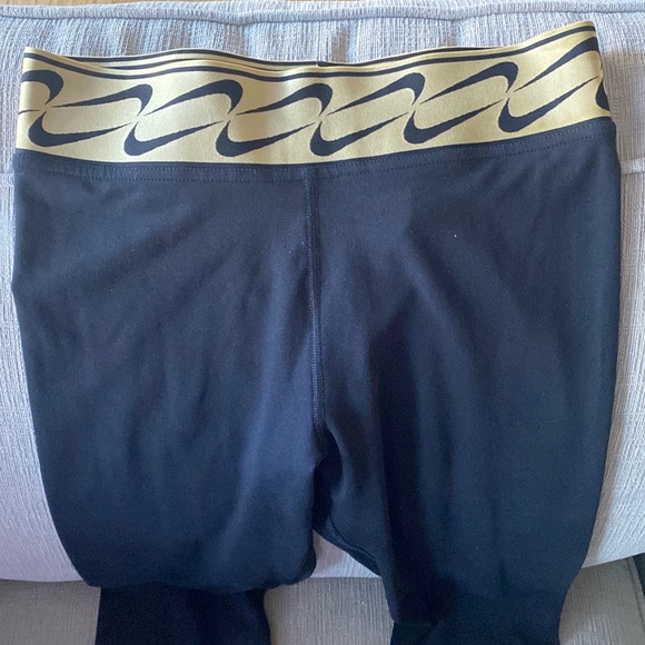 New** size S - Nike Pants Nike Gold Swoosh Leggings Color: Black/Gold - Picture 1 of 6